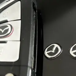 Alternative view of 1x MAZDA new Schlüssel 13x11mm Aufkleber ALU Schlüssellogo Emblem Schriftzug LOGO