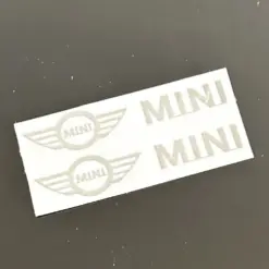 1x MINI Aluschild 48x10mm Lenkrad Spiegel Aufkleber Logo Emblem Copper R56 57 58 Cabrio R60 R61 Clubman Countryman