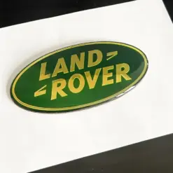 1x neu LAND ROVER Grill Emblem 8,6 x 4,3cm grün/gold Emblem Schriftzug Logo LR053190G